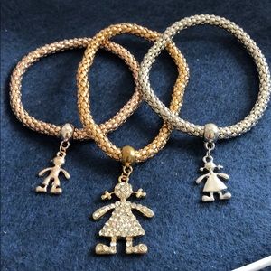 3 coloured bracelets stretched with pendents